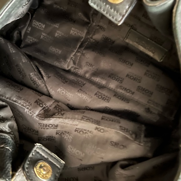 Michael Kors black leather hobo bag with gold hardware and black tassel. - Picture 3 of 3